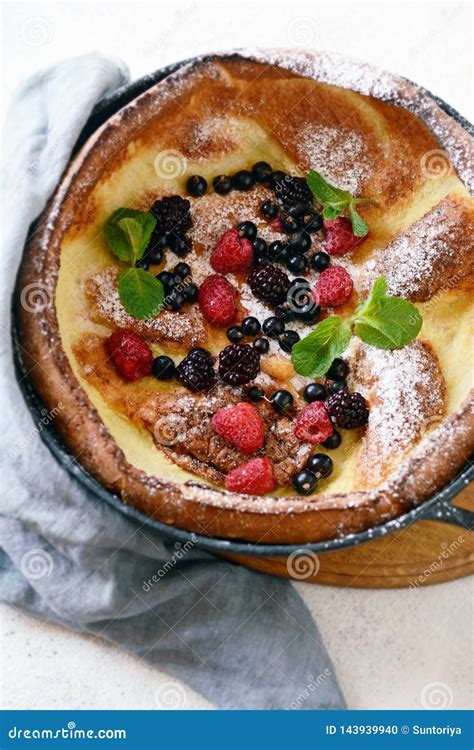 Fresh Homemade Dutch Baby Pancake With Powdered Sugar Fresh Berries