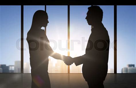 Business Partners Silhouettes Shaking Hands Stock Image Colourbox