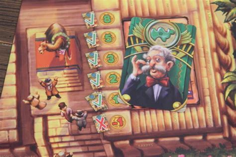 Players place bets on a camel race in the desert; Camel Up Board Game Review and Rules | Geeky Hobbies