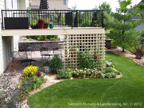 If traditional patio pavers are not your style, then consider this option to blend in with your wall. Paver Patio Under Deck with Retaining Wall & Steps | Flickr