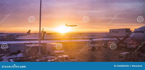 Airplane Landing At Jfk Airport In New York During Sunrise United