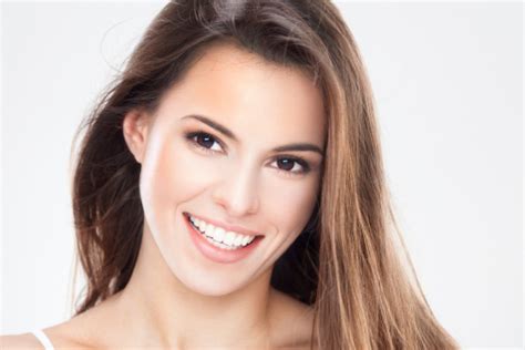 Beauty Portrait Of A Young Brunette Woman With Beautiful Smile Stock