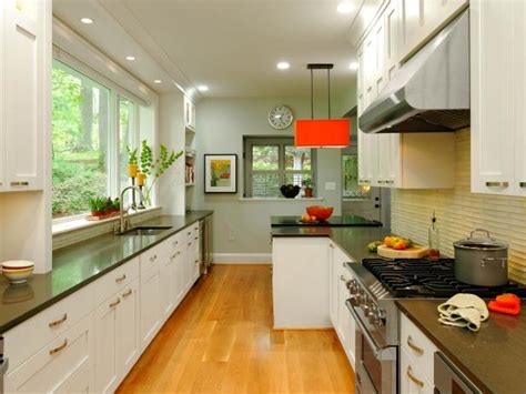 Contemporary Galley Kitchen With Sleek Cabinetry And Orange Pendant Hgtv