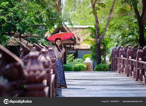 Beautiful Thai Girl In Traditional Dress Costume Red Umbrella As