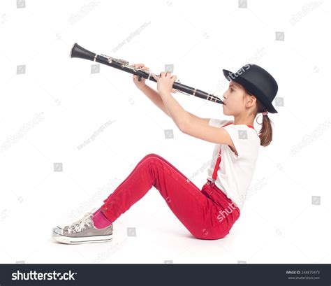 Little Girl Playing Clarinet On White Stock Photo