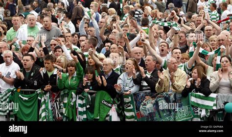 Mourners Watch The Funeral Procession Of Celtic Legend Tommy Burns