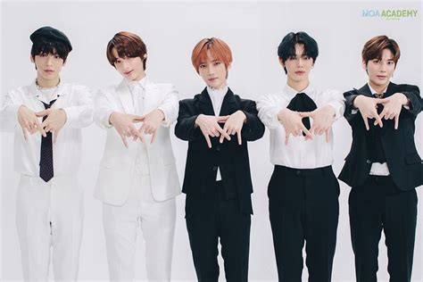 Four Babe Men In White Shirts And Black Ties Posing For The Camera With Their Hands Together