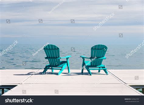 2 Adirondack Chairs On Beach Stock Photos Images And Photography