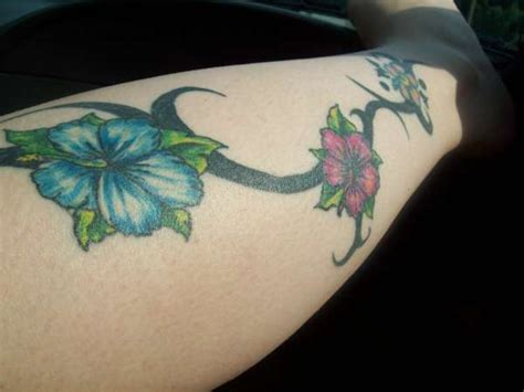 Grey and black hibiscus tattoo on ankle. Tribal and Hibiscus tattoo