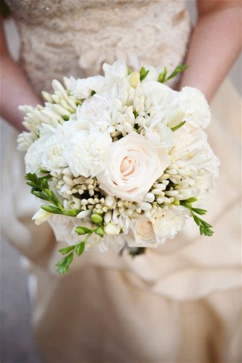 With big delicate blossoming petals, peonies work great paired in a bouquet with other cream colored flowers and eucalyptus. Lovely in White - Bouquet Wedding Flower