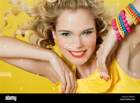 Young Blonde Woman Against Yellow Background Stock Photo Alamy