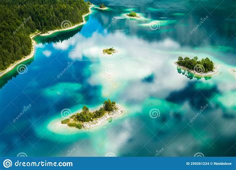 Amazing Islands With Trees On A Lake With Turquoise Water And Clouds