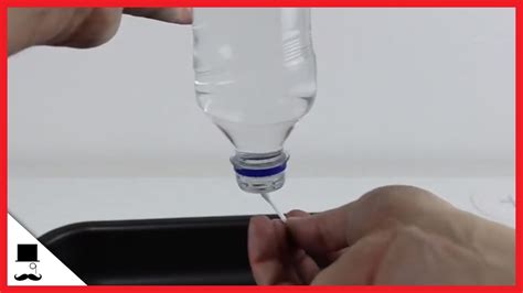 Trick With Waterbottle Upside Down Going Trough The Surface Tension