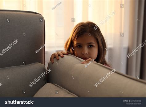 Sad Little Girl Hiding Behind Sofa Stock Photo 2192971361 Shutterstock