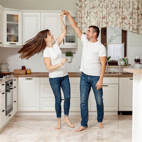 Free Photo Happy Couple Dancing In Kitchen