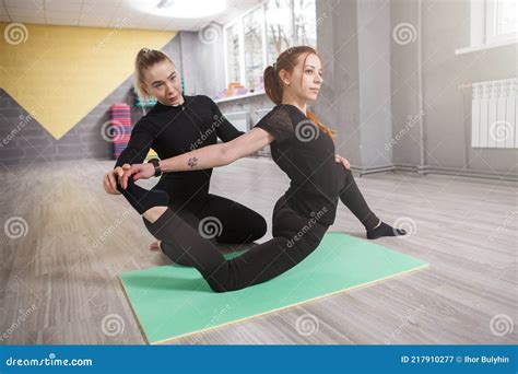 Yoga Instructor Helping Her Client In Class Stock Image Image Of Profession Learning