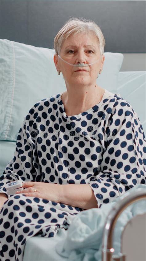 Portrait Of Elder Patient With Illness Looking At Camera Stock Photo