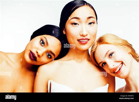 three different nation woman asian african american caucasian together isolated on white