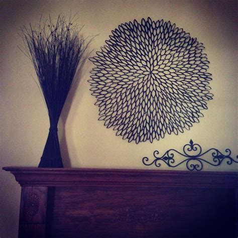 A faux metal piece made of recycled toilet paper rolls. Paper towel roll wall art | Crafts, Diy crafts, Paper towel rolls