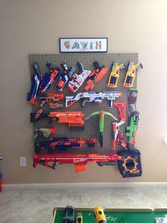 If you have a lot of nerf guns you may need quite a few of these! My husband hangs his Nerf Guns armory style in our bedroom. | Nerf and Guns