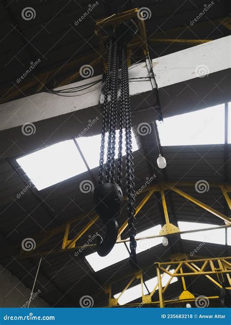 Overhead Crane Hook Connected With Chain In The Industry Stock Photo