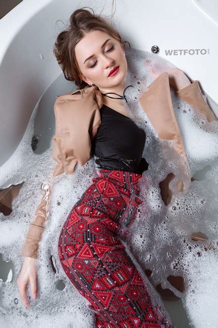 Fully Clothed Girl In Coat And Hat Get Soaking Wet In Bubble Bath