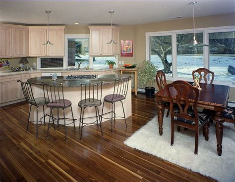 De doors and drawer can not be opened. walnut flooring sets off the white pickled maple cabinets in this kitchen addition on a 1950's ...