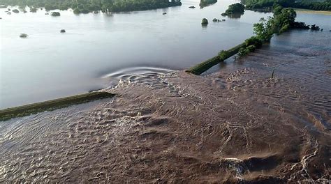 Record Floods Breach Three Levees