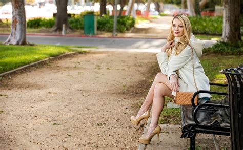 Beautiful Girl Fashion Model Kenna James Is Sitting On The Bench In The