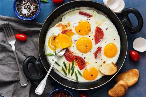 Fried Eggs With Tomato And Green Onions In A Pan Fresh Breakfast Stock