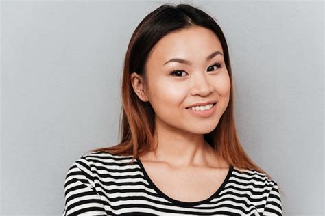 premium photo portrait of cheerful smiling asian woman