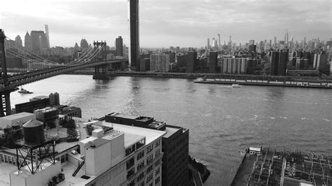 View Of The East River Manhattan Bridge And New York City In Black An