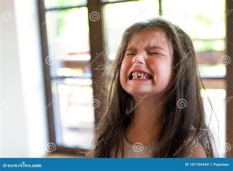 Portrait Of Angry Small Girl Indoors Crying Stock Photo Image Of