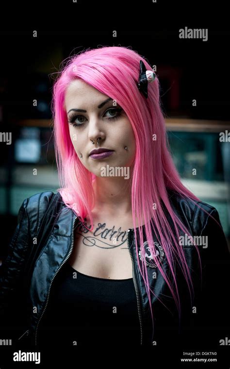 Atrractive Girl With Pink Hair And Face Piercings At The London International Tattoo Convention