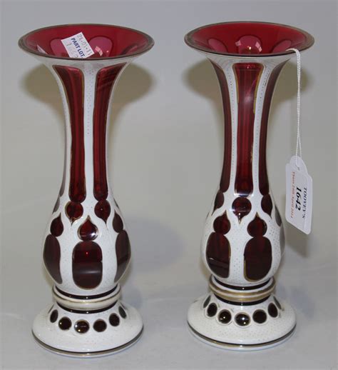 A Pair Of Bohemian White Flash Overlay Cranberry Glass Vases Late 19th Century Each With Flared Ne