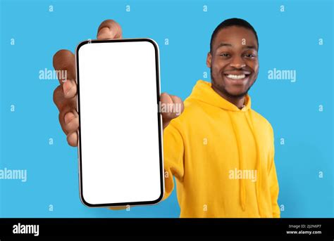 Mobile Ad Joyful Black Guy Showing Big Blank Smartphone With White