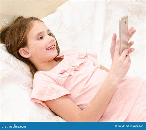 Cute Smiling Little Girl Child With Her Mobile Phone Smartphone Stock