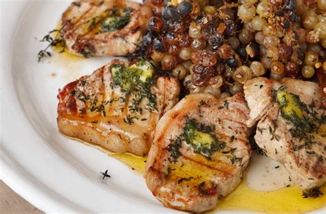 Cook pork for three hours in a slow cooker, add potatoes and cook another two hours, then finish by adding mustard greens and cooking just until. Pork Loin Chops with Thyme Oil and Roasted Grapes on the ...