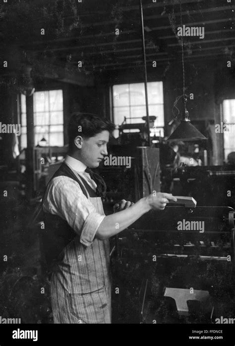Hine Child Labor 1917 Na Boy Operating An Automatic Press At The