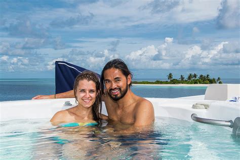 Couple Enjoying Time In A Hot Tub Photograph By Henn Photography