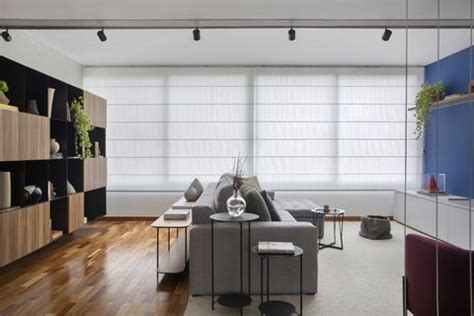 A Living Room Filled With Furniture And Lots Of Windows