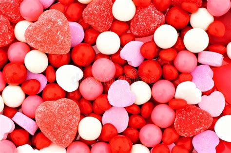 Pink and white candy may be made of spun sugar, jaggery, chocolate, fruits and mint. Valentines Day Candy Background Stock Image - Image of ...