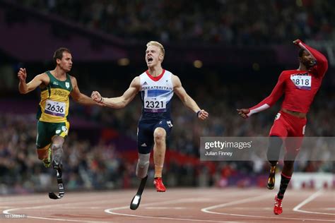 Jonnie Peacock Of Great Britain Crosses The Line To Win Gold In The