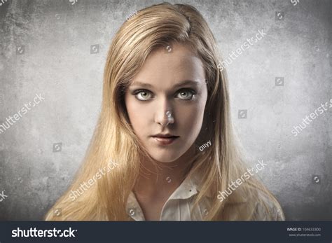 Portrait Of A Serious Beautiful Young Woman Stock Photo 104633300