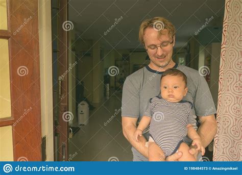 Father And Baby Son Bonding Together At Home Indoors Stock Image Image Of Parent Newborn