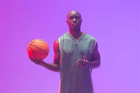 Image Of African American Basketball Player With Basketball On Neon