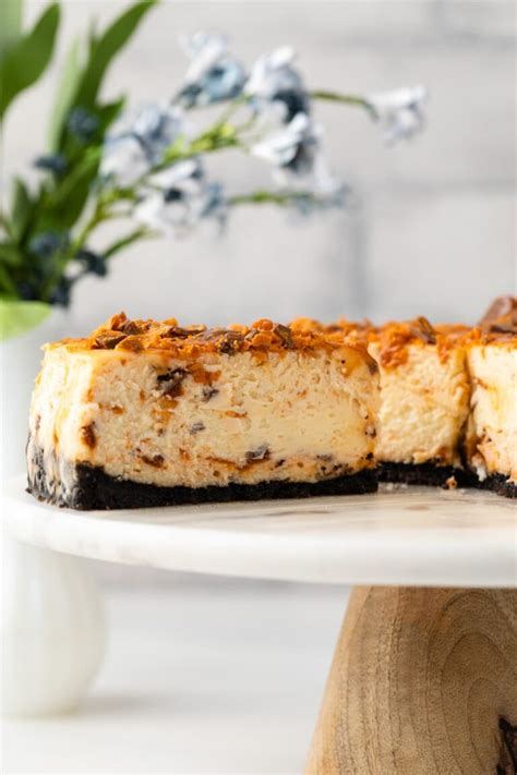Butterfinger Cheesecake With Caramel Drizzle Baked By An Introvert