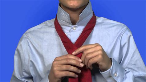 To tie the half windsor knot, select a necktie of your choice and stand in front of a mirror. From The Corps: How to Tie a Half-Windsor Knit - YouTube