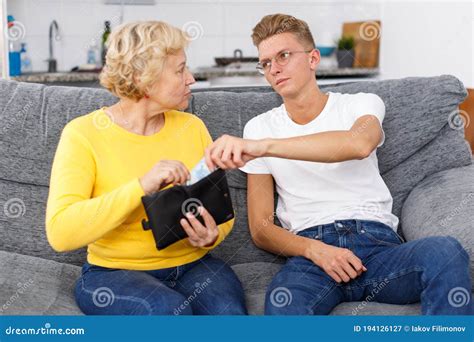 Mother Giving Some Cash Her Son Stock Image Image Of Elderly Home