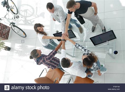 Creative Team With Hands Clasped Together Stock Photo Alamy
